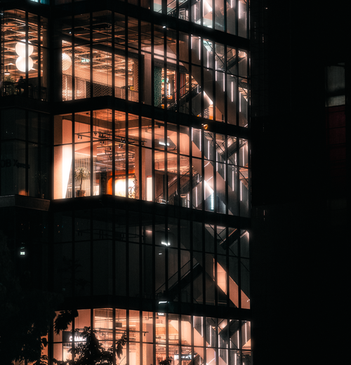 Free Stunning night shot capturing the illuminated interior of a modern building in Bangkok. Stock Photo
