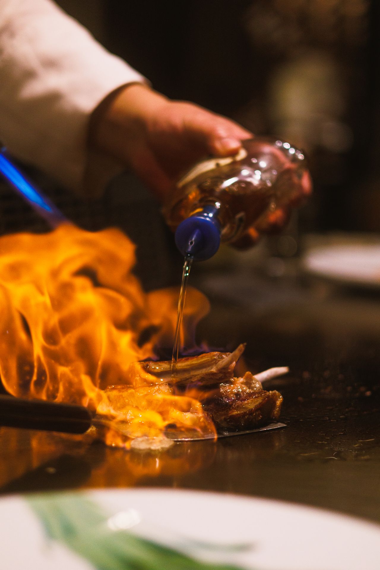 A chef working the teppanyaki grill