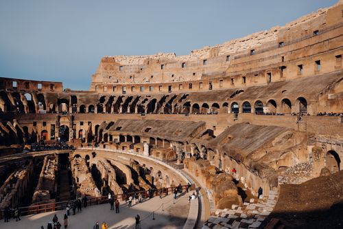 Free Explore the breathtaking interior of the Colosseum in Rome with its ancient architecture and historical ambiance. Stock Photo