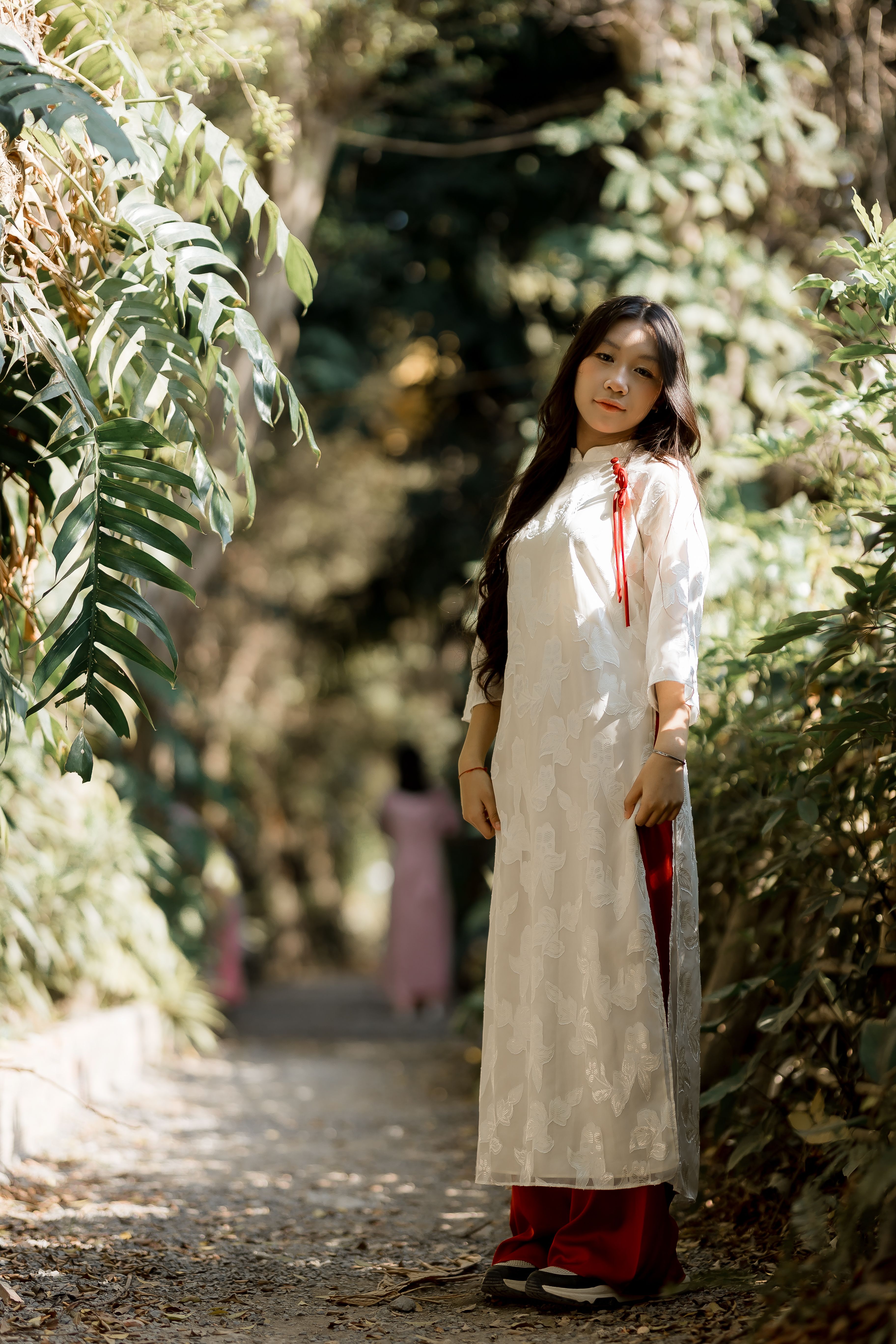 Woman in Traditional Dress Strolling Outdoors · Free Stock Photo