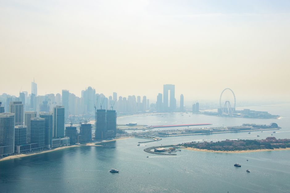Best Ultimate Dubai Helicopter Tour with Optional Transfers Review Review 2026 - A stunning aerial view of Dubai Marina's skyline, featuring modern skyscrapers and the iconic ferris wheel in the distance.