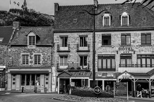 Black and white image of traditional French hotel facade in Brittany.