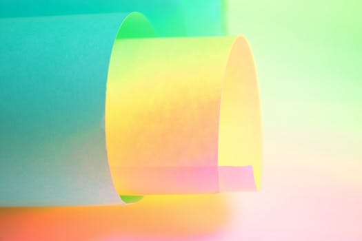 Vibrant and abstract rolled paper in a colorful gradient, ideal for backgrounds or artistic presentations.