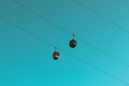 Black Cable Cars Under Blue Sky
