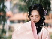 Serene Woman in Traditional Attire Outdoors