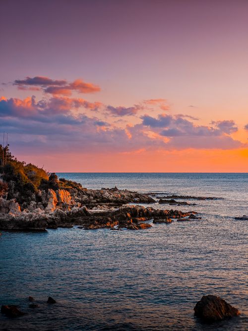 Free Breathtaking sunset over the rocky coastline of Kargicak, Antalya, Turkey. Stock Photo
