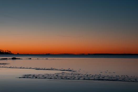 Tranquil dawn at Cove Island Park in Stamford, Connecticut with vibrant sunrise colors.