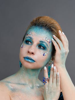 Chic woman adorned with glitter and jewels, inspired by aquatic themes.