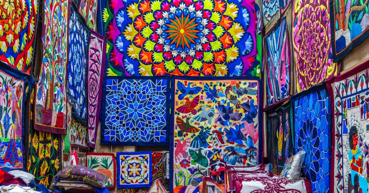 Colorful textile patterns inside a Cairo market, showcasing traditional Egyptian designs.
