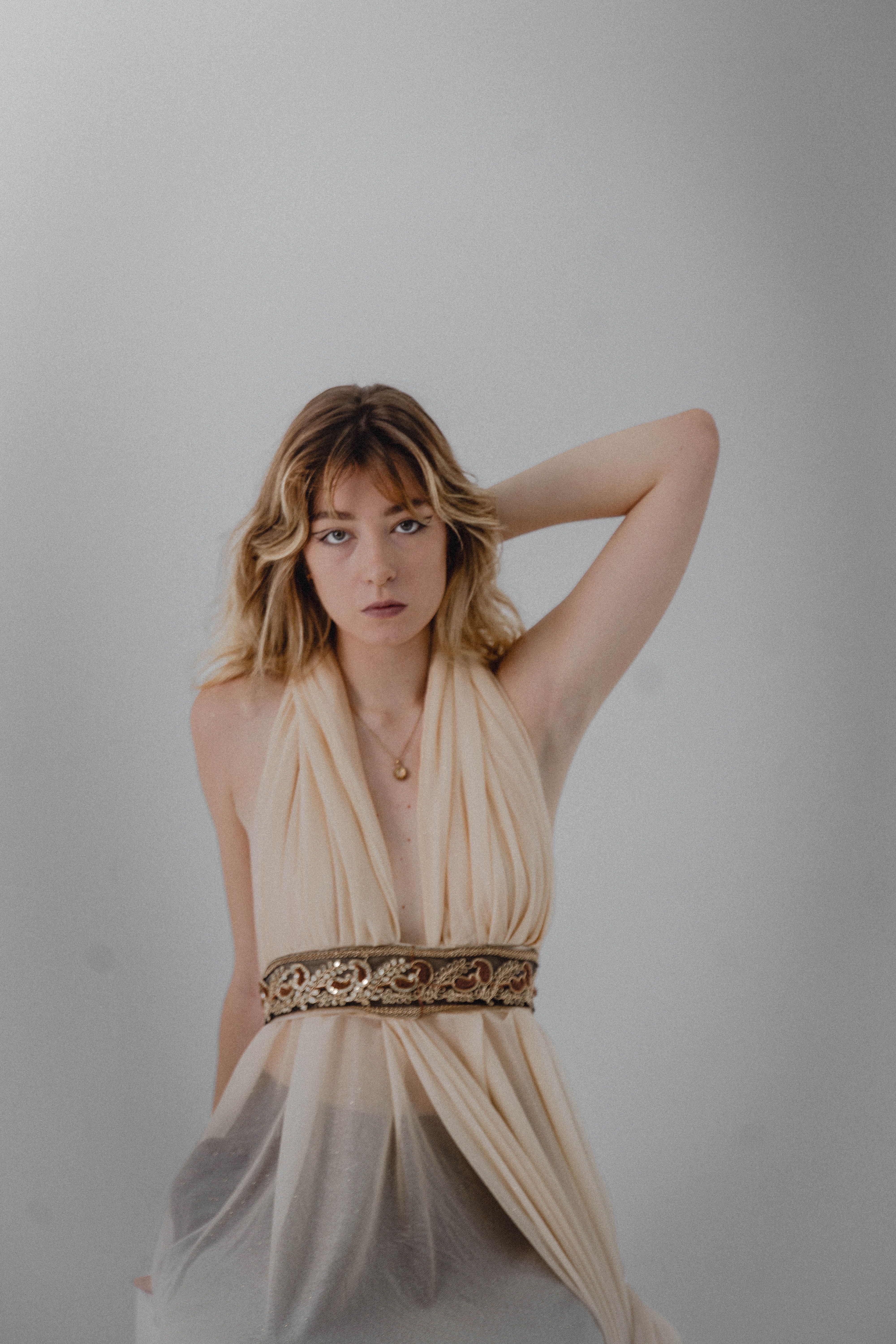 Elegant Portrait of a Woman in Beige Dress · Free Stock Photo