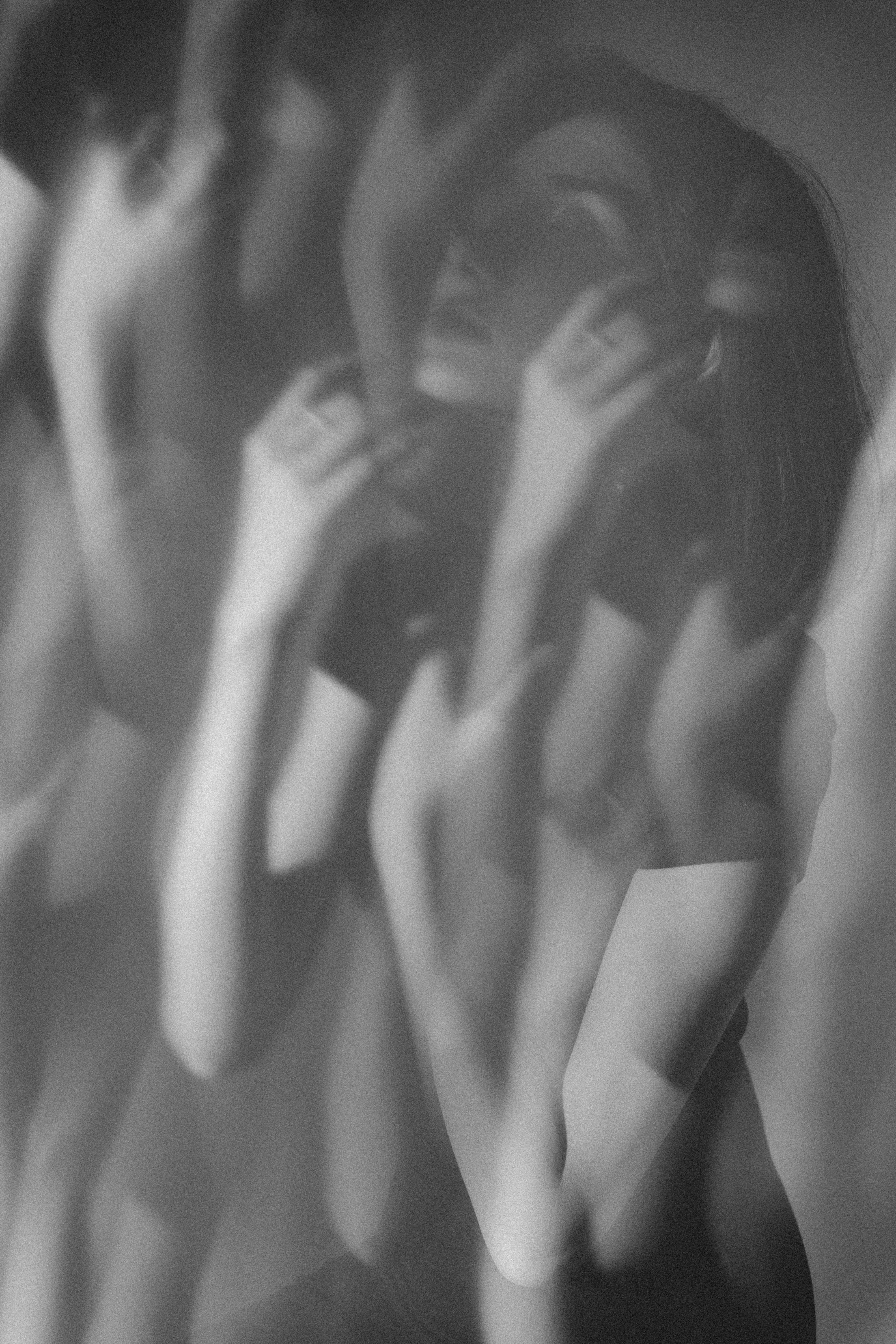 Mystical black and white portrait featuring double exposure technique and ethereal mood.