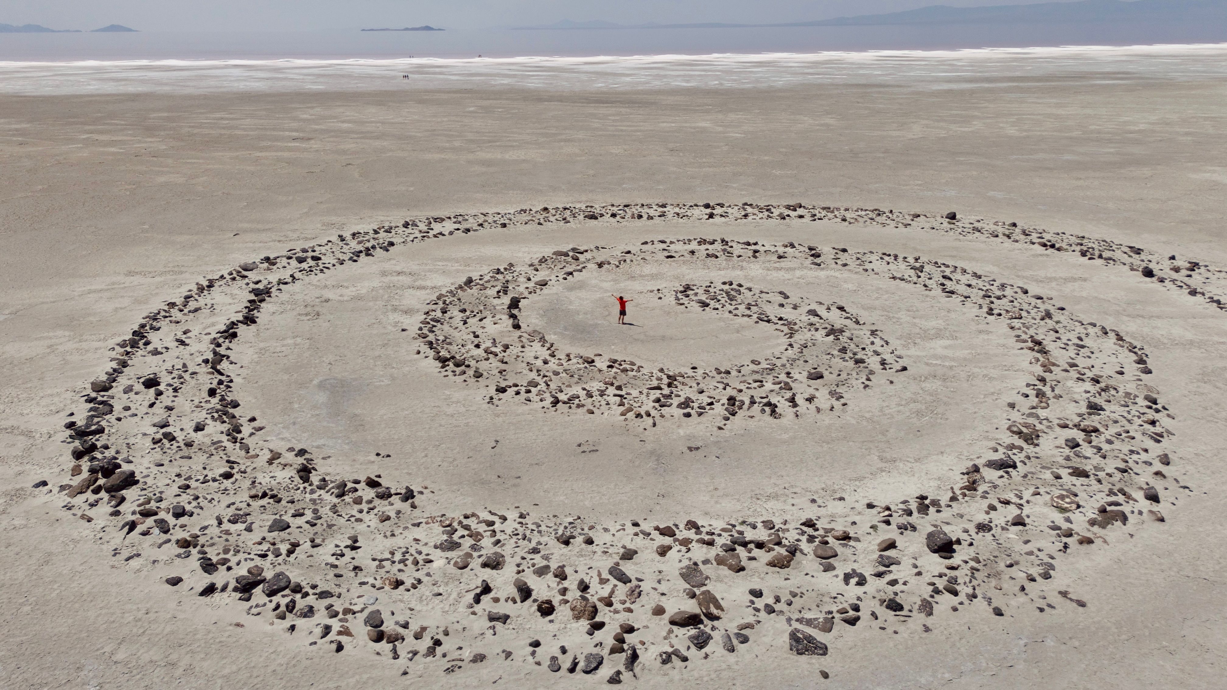 Aerial view of Spiral Jetty in Corinne, Utah, showcasing land art and natural beauty.