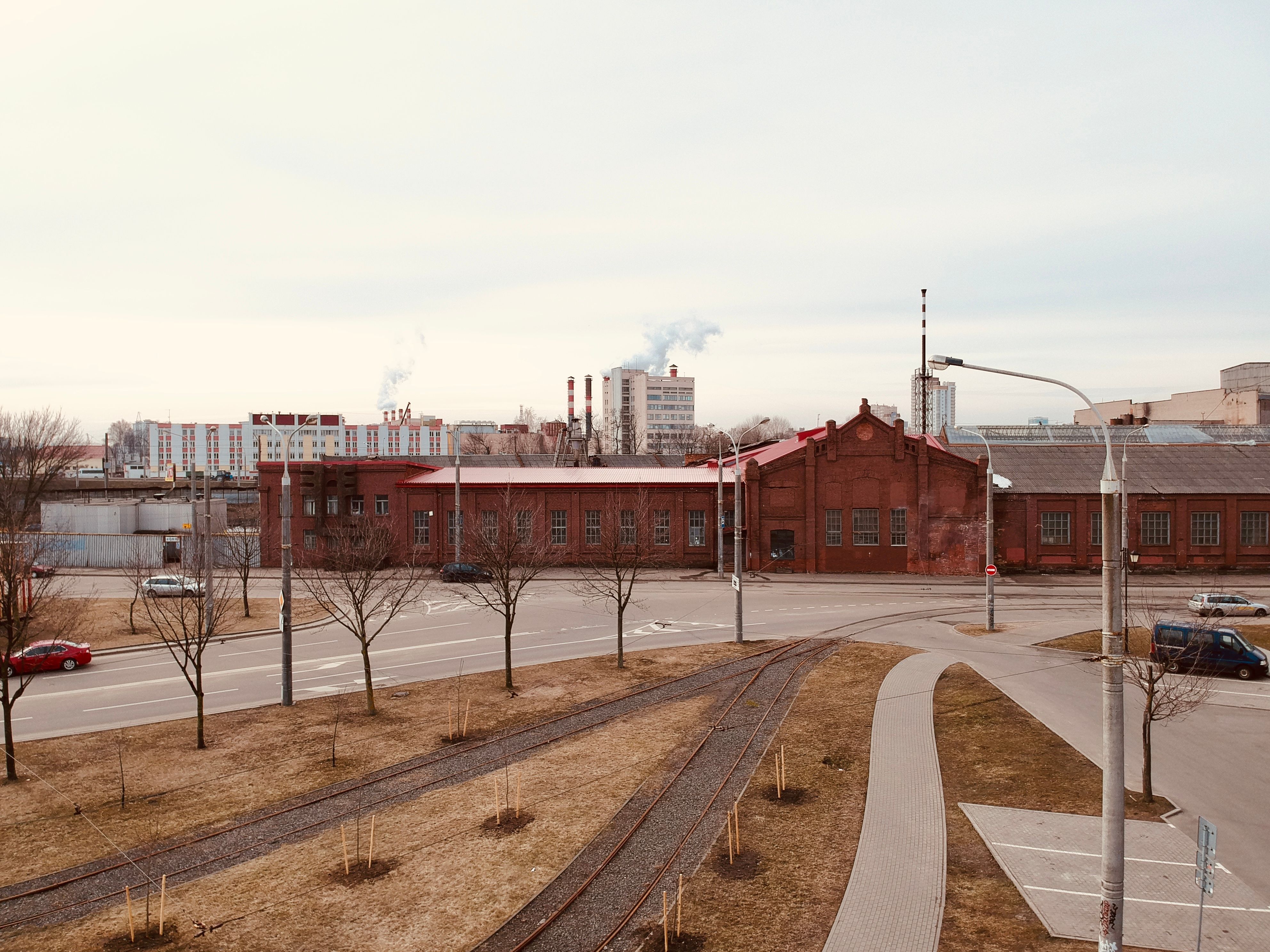 A winter urban landscape featuring an industrial brick building in Minsk, Belarus.