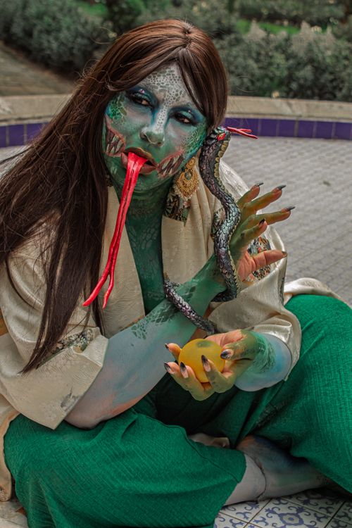 Free Fantasy cosplay portrait featuring mythical serpent character with vibrant colors. Stock Photo