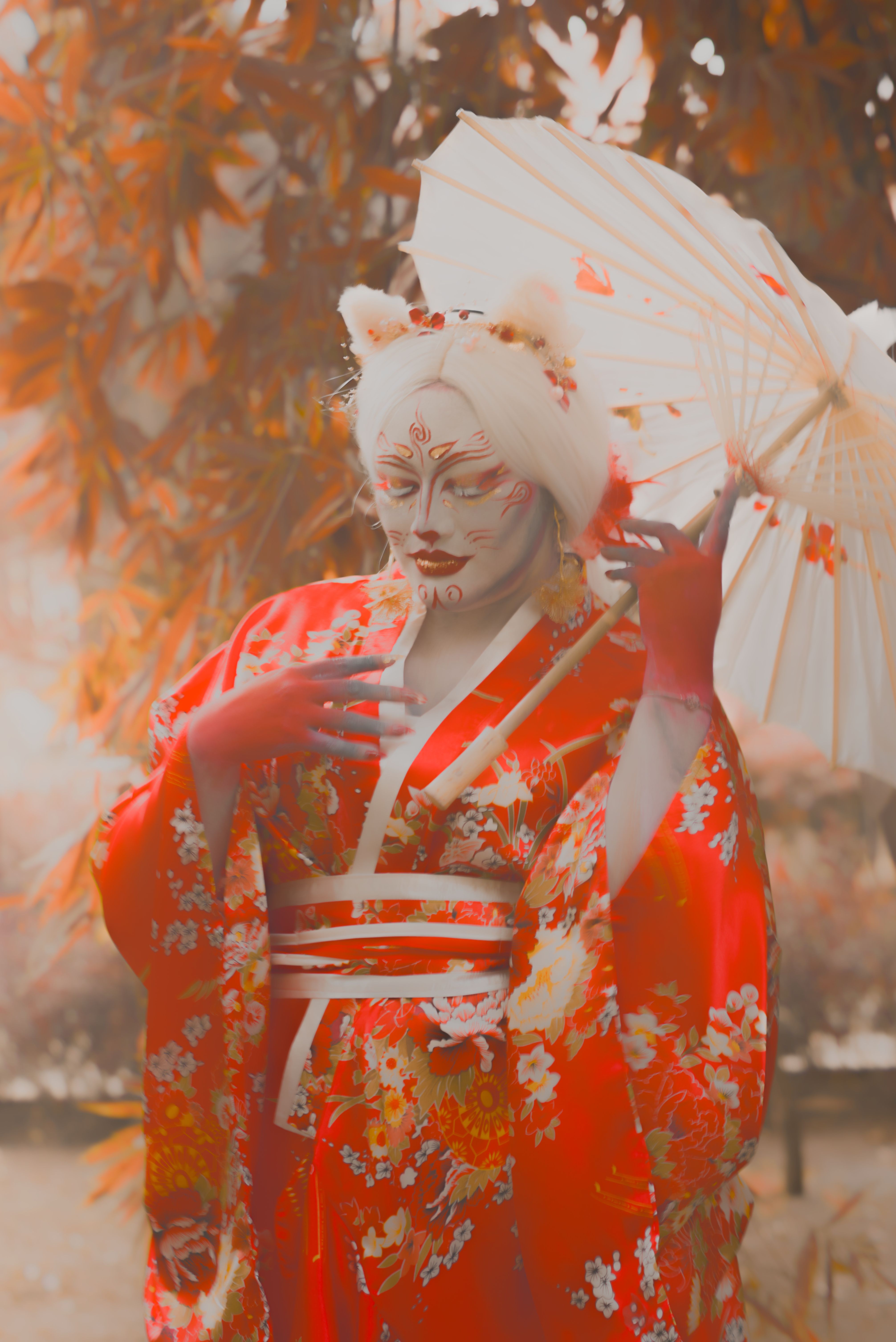 Vibrant portrayal of a person in a kimono, with a fox mask and a parasol, exuding cultural elegance.