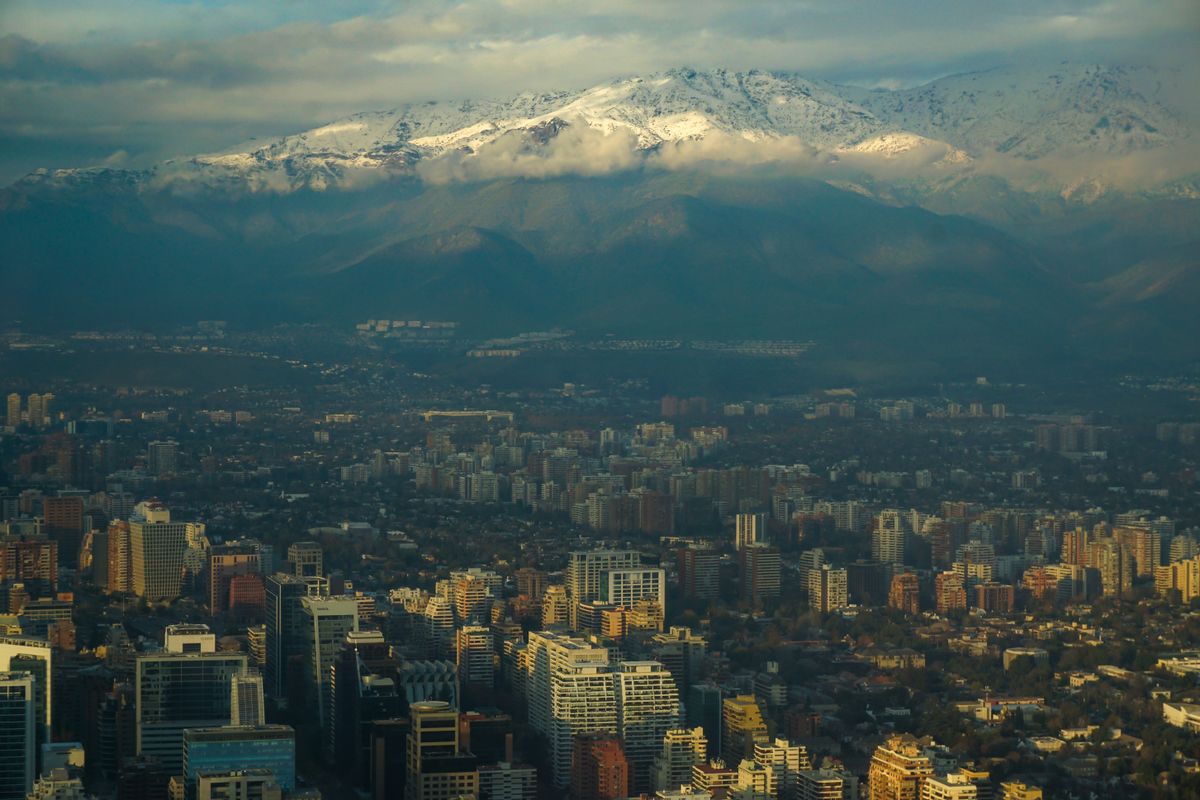 Modern Santiago skyline framed by the majestic snow-capped Andes mountains