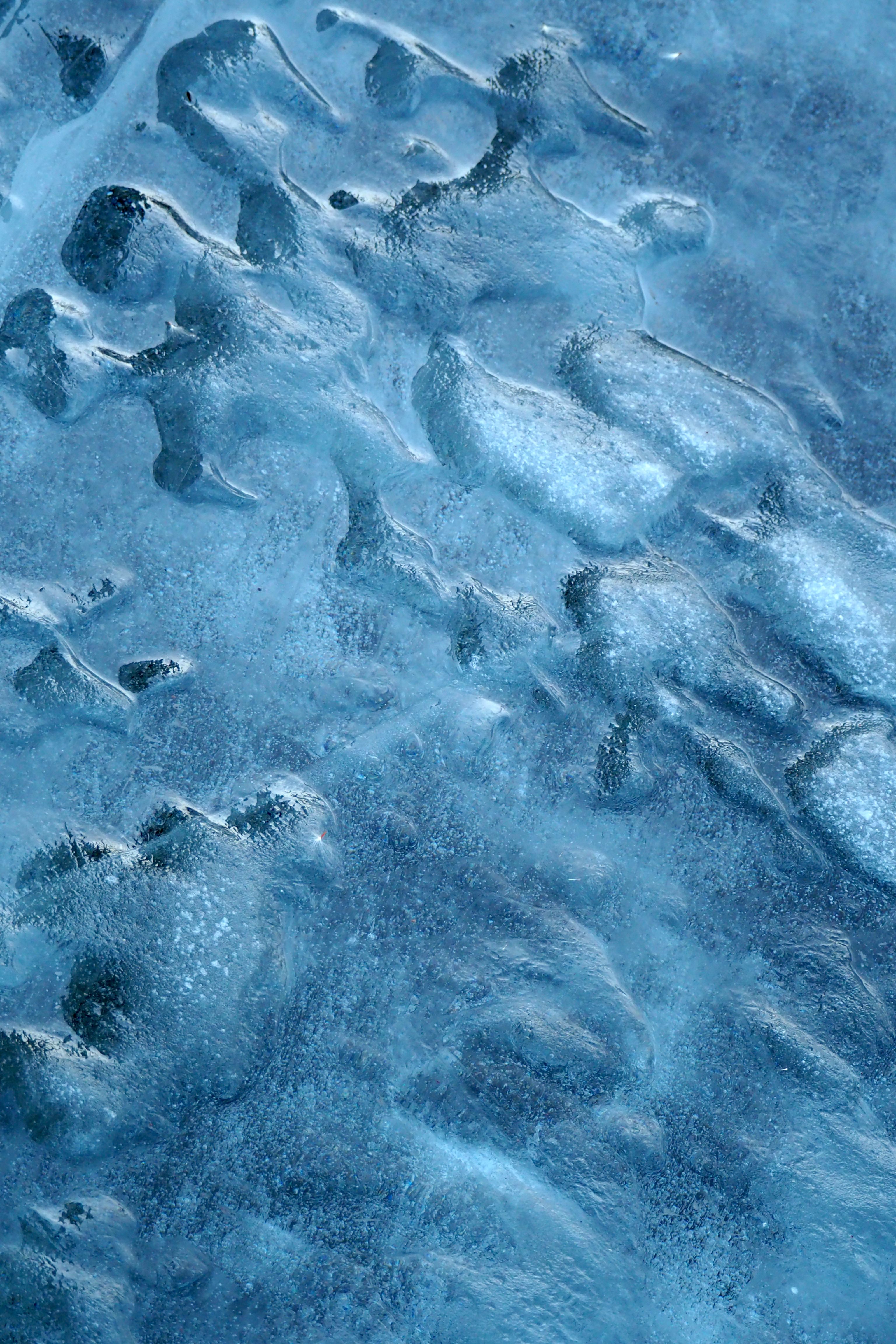 Detailed blue ice texture captured in winter, showcasing natural cold and icy formations.. detailed, blue, texture