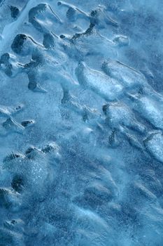 Detailed blue ice texture captured in winter, showcasing natural cold and icy formations.. detailed, blue, texture