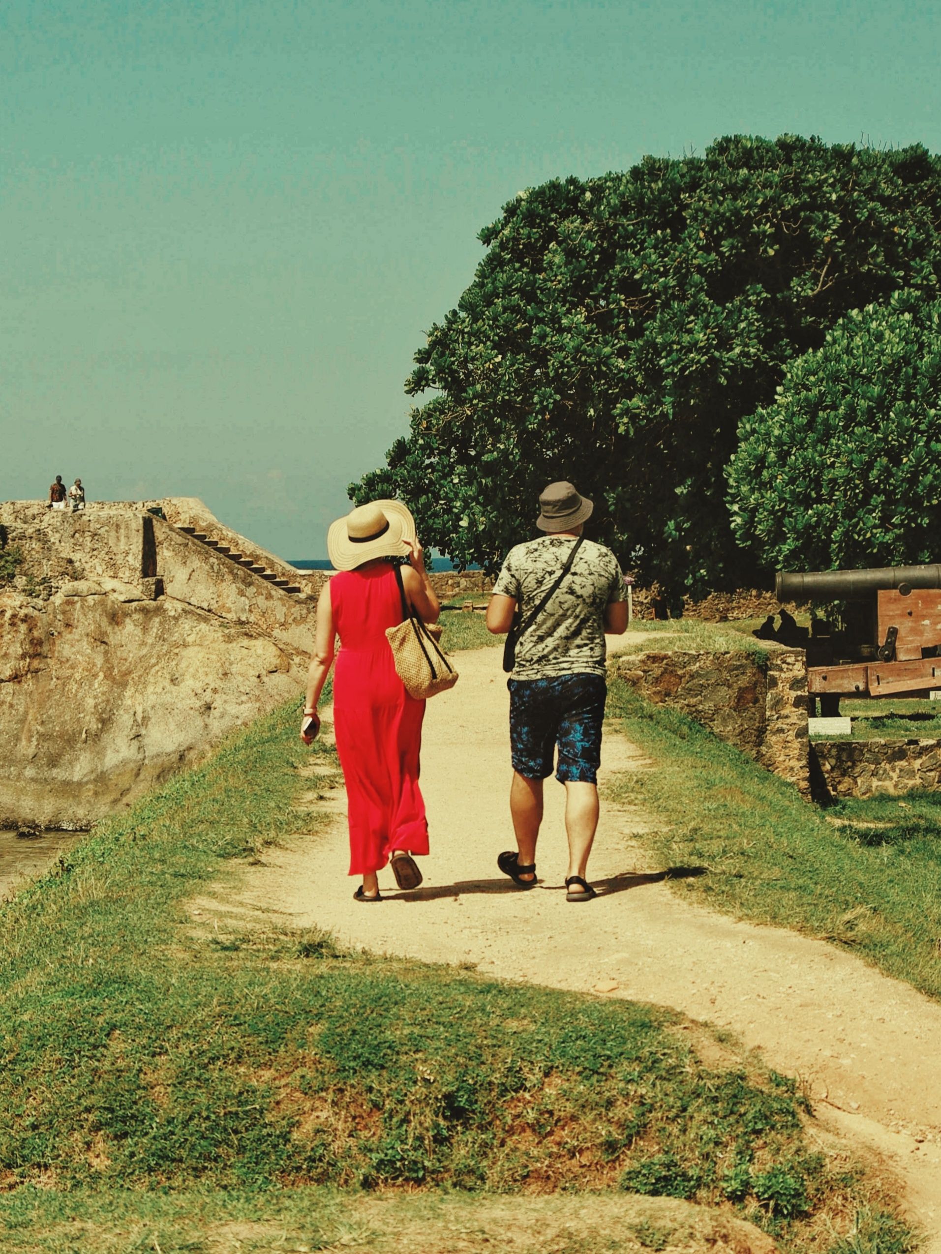 Couple Walking on Historic Outdoor Pathway · Free Stock Photo