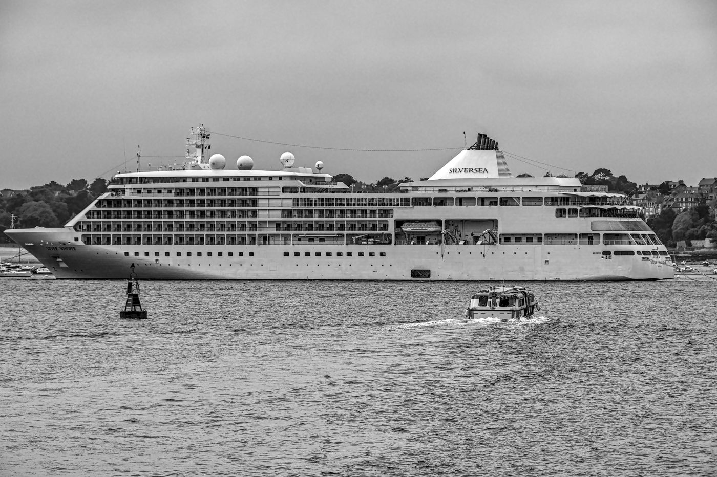 A Silversea cruise ship at anchor off the coast of Brittany, France, in black and white
