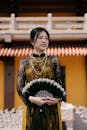 Elegant Woman in Traditional Dress at Temple