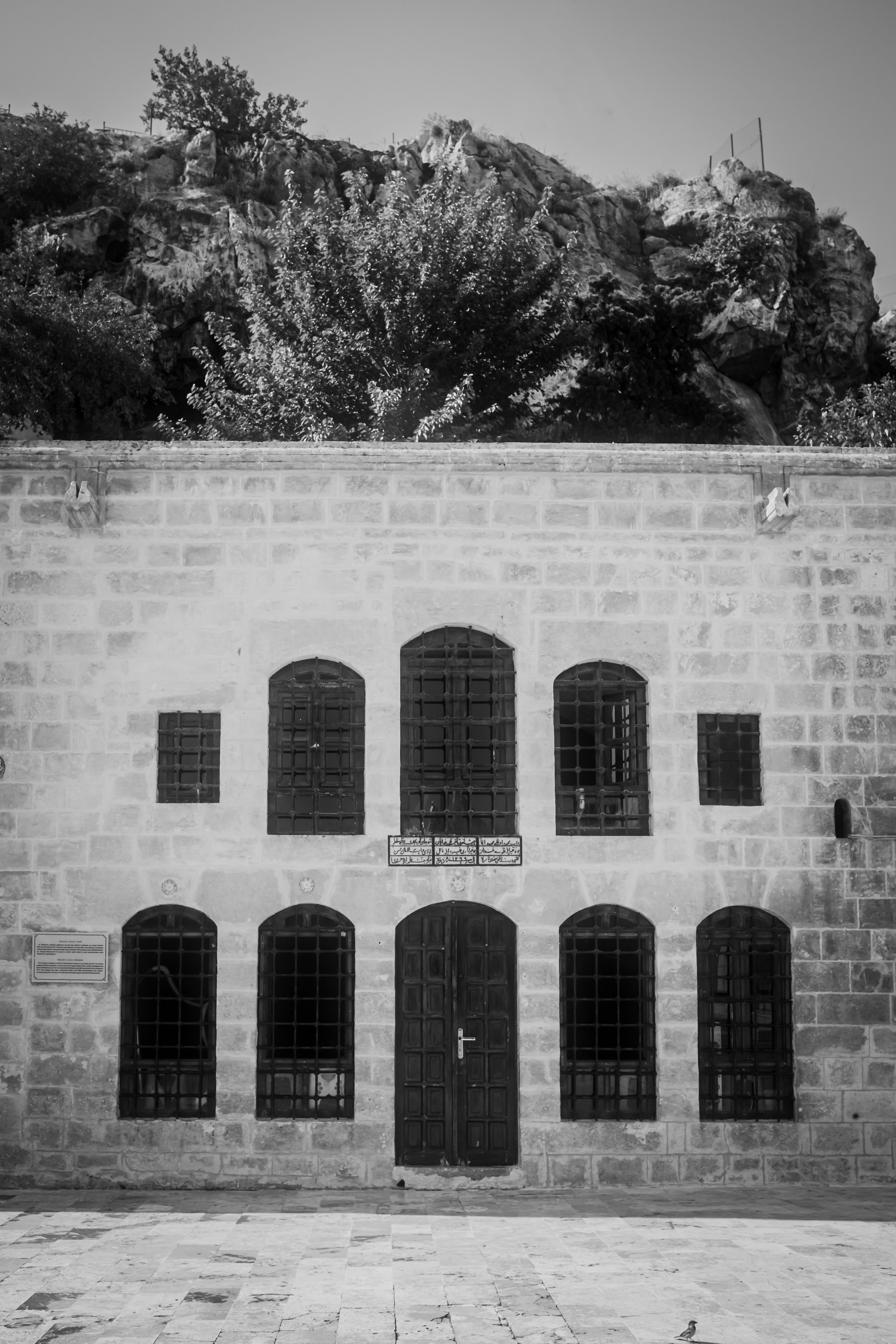 Historic Stone Building with Arched Windows · Free Stock Photo