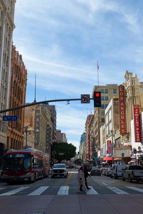 Free Vibrant street view in Los Angeles featuring traffic and pedestrians on a sunny day. Stock Photo