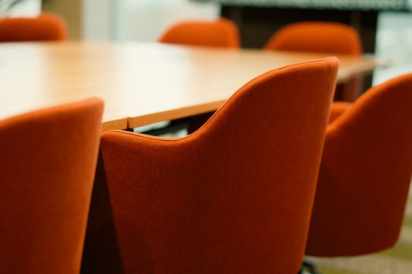 Empty boardroom chairs — photo by Jakub Zerdzicki on Pexels