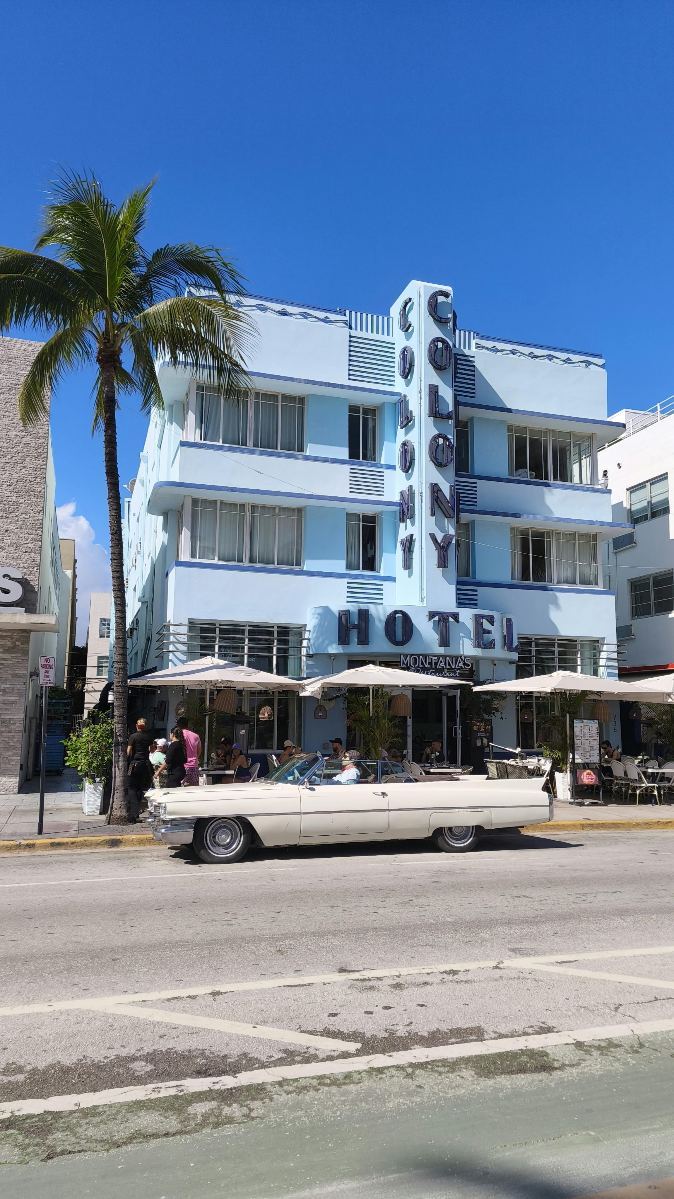 Vintage car parked outside the Colony Hotel on Miami Beach's Art Deco strip