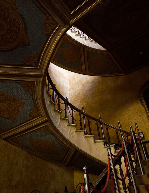Free A luxurious curved staircase with ornate decor in an Istanbul mansion, showcasing architectural elegance. Stock Photo