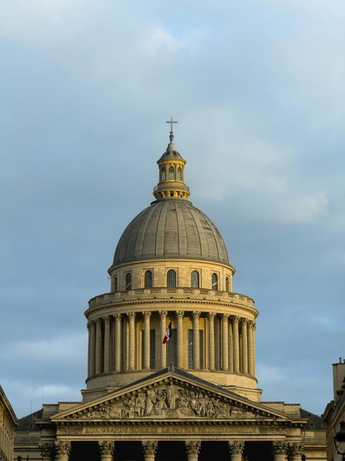 Free The Panthéon dome in Paris with a dramatic sky backdrop, showcasing classical architecture. Stock Photo