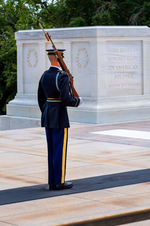 Free Tomb of the Unknown Soldier guarded by a soldier at Arlington National Cemetery. Stock Photo