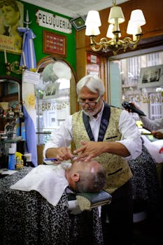 Barber performing a classic shave in a vintage Buenos Aires shop, showcasing timeless style.