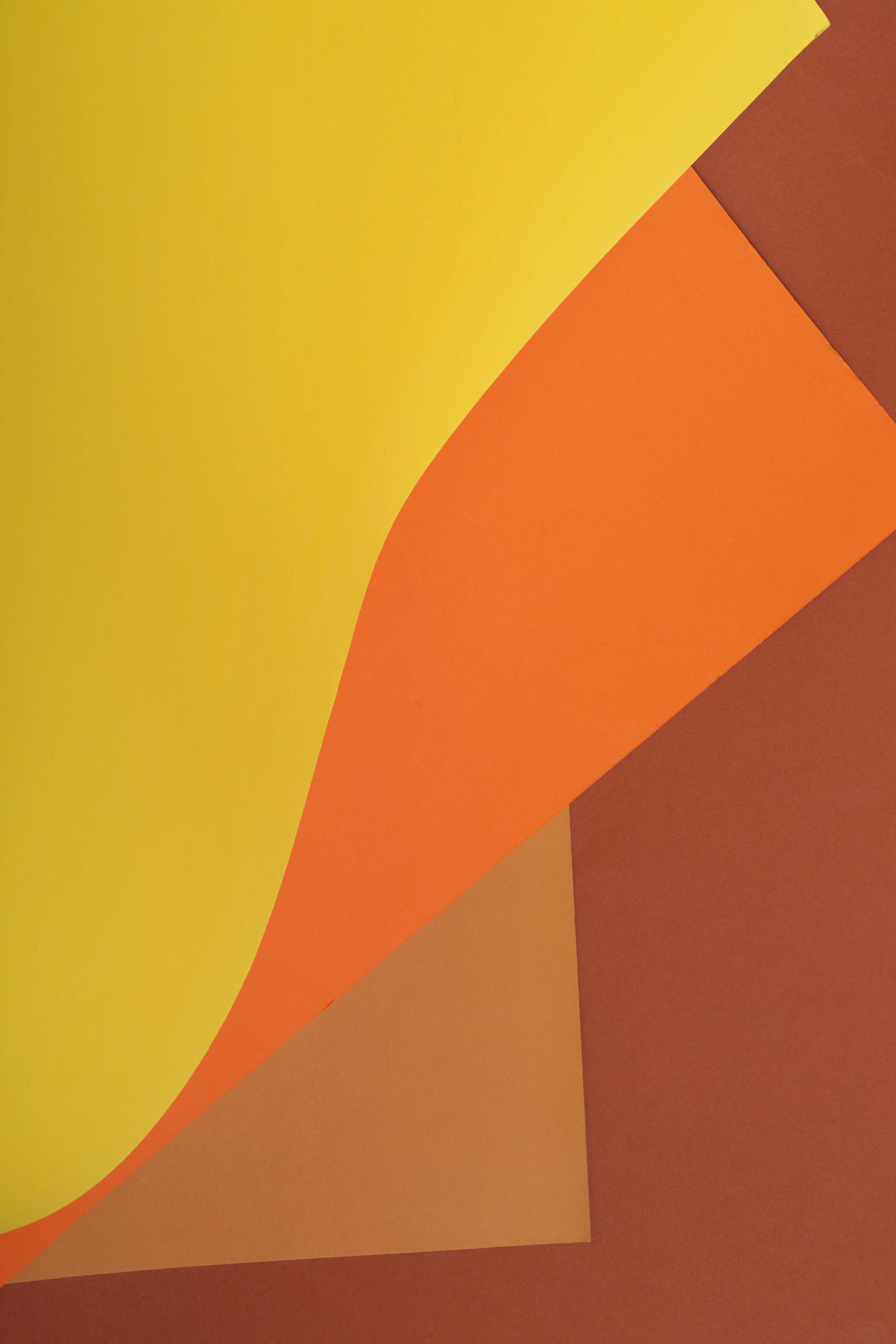 Gratis Composición abstracta brillante con capas superpuestas de papel amarillo, naranja y marrón. Foto de stock