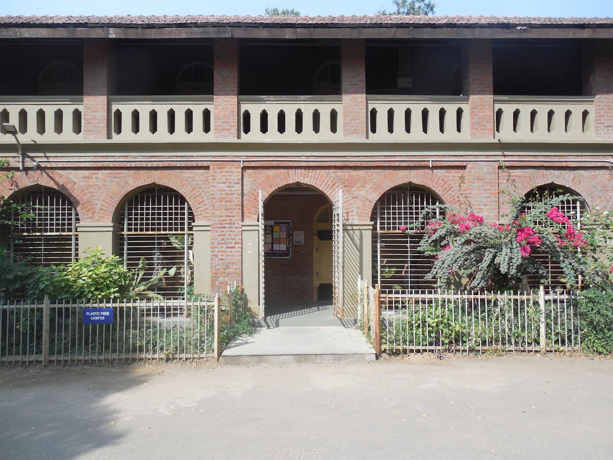 Educational building with brick facade and landscape