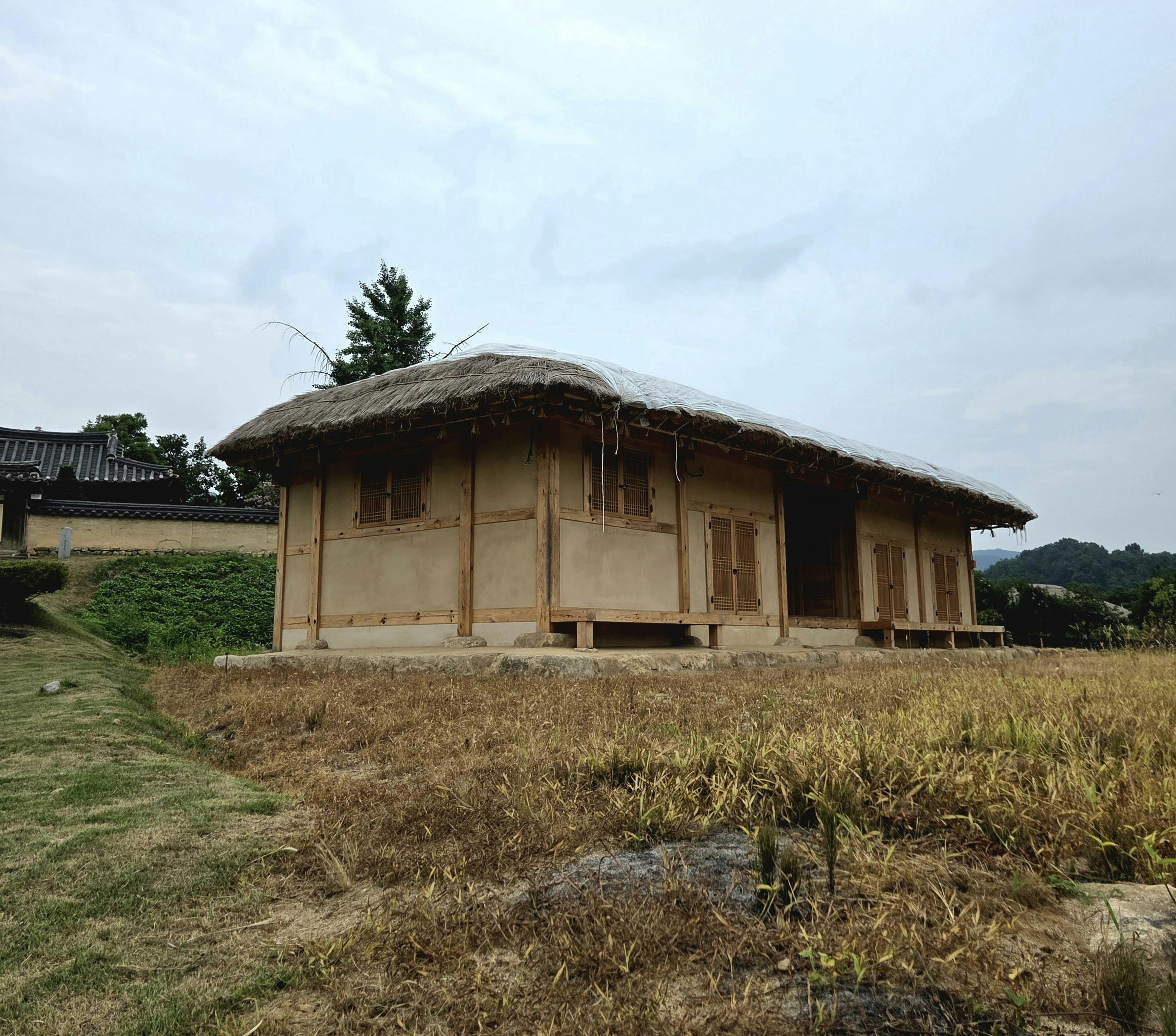 Rustic traditional Korean hanok with thatched roof in Andong-si, South Korea.