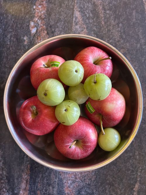 Free Top view of red apples and green grapes in a stainless steel bowl, perfect for health and freshness themes. Stock Photo