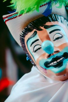 Vibrant close-up of a clown mask with detailed face paint and expressive features.