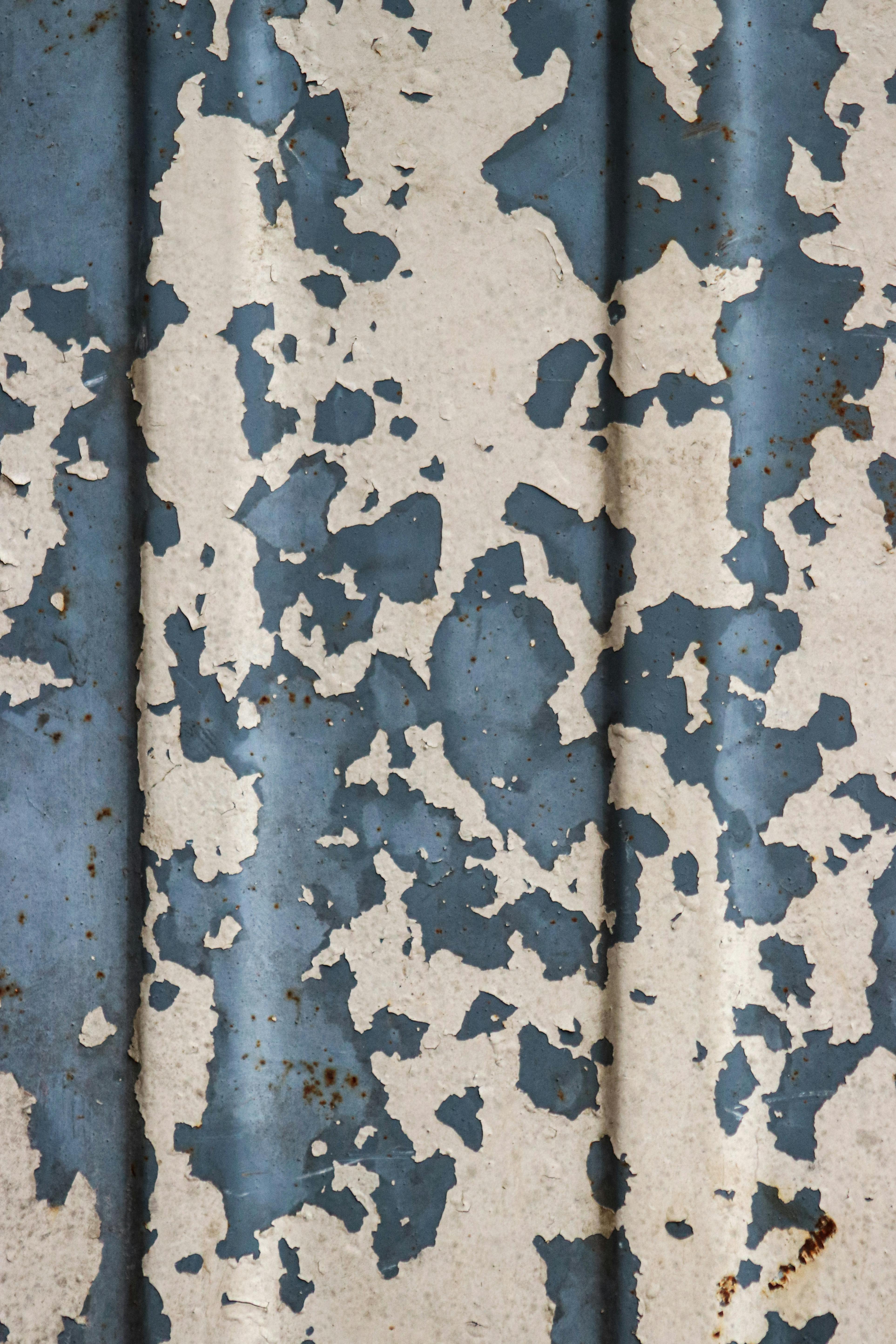 Free Detailed texture of weathered blue and white peeling paint on a metal surface, showcasing rustic decay. Stock Photo