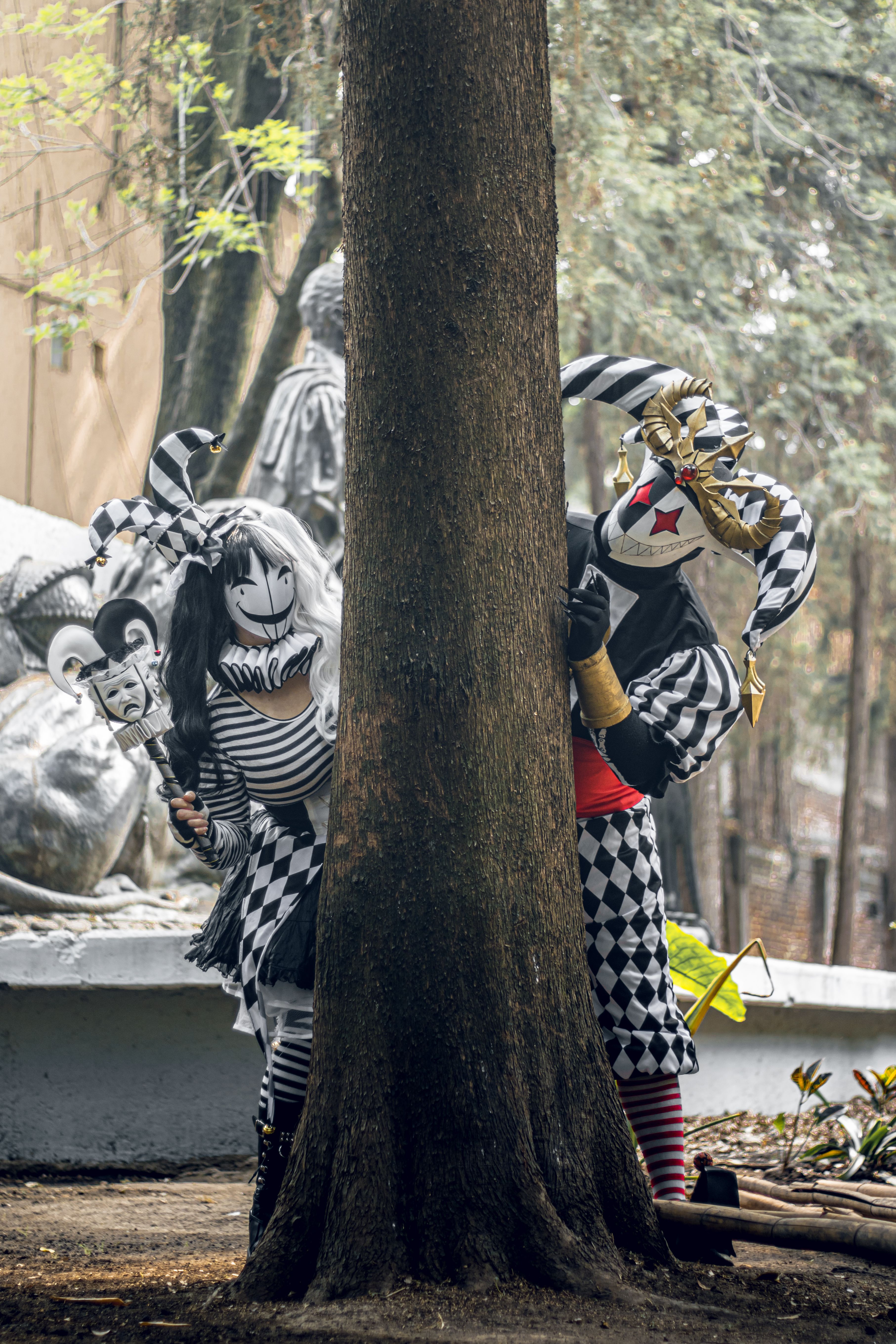 Whimsical Cosplay Characters in Park Setting