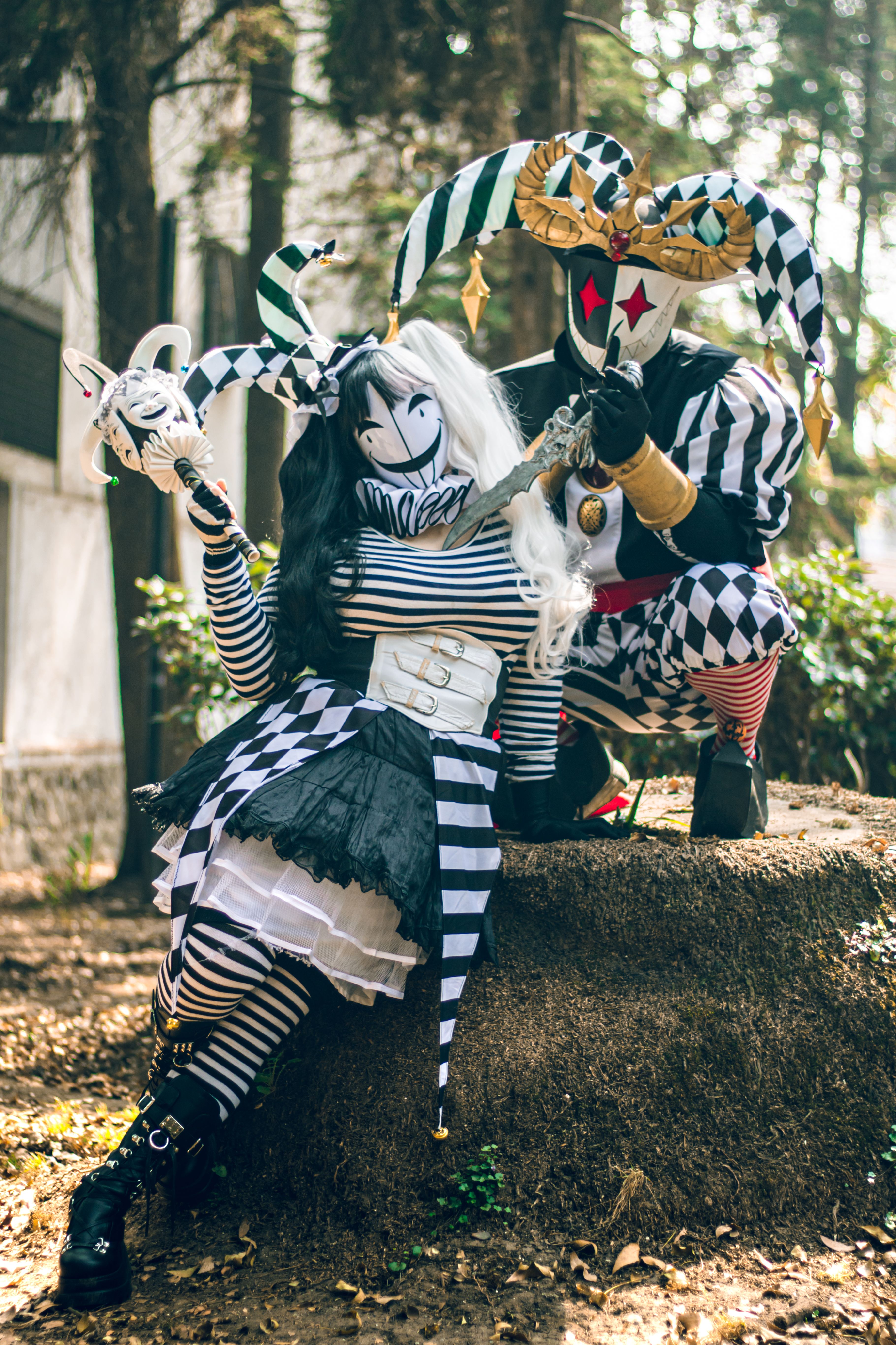 Colorful Jester Cosplay in Urban Park Setting