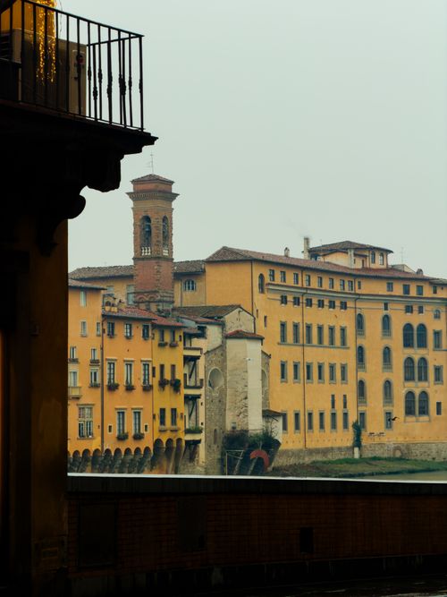 Free Charming view of Florence's historic buildings along the Arno River, Tuscany, Italy. Stock Photo