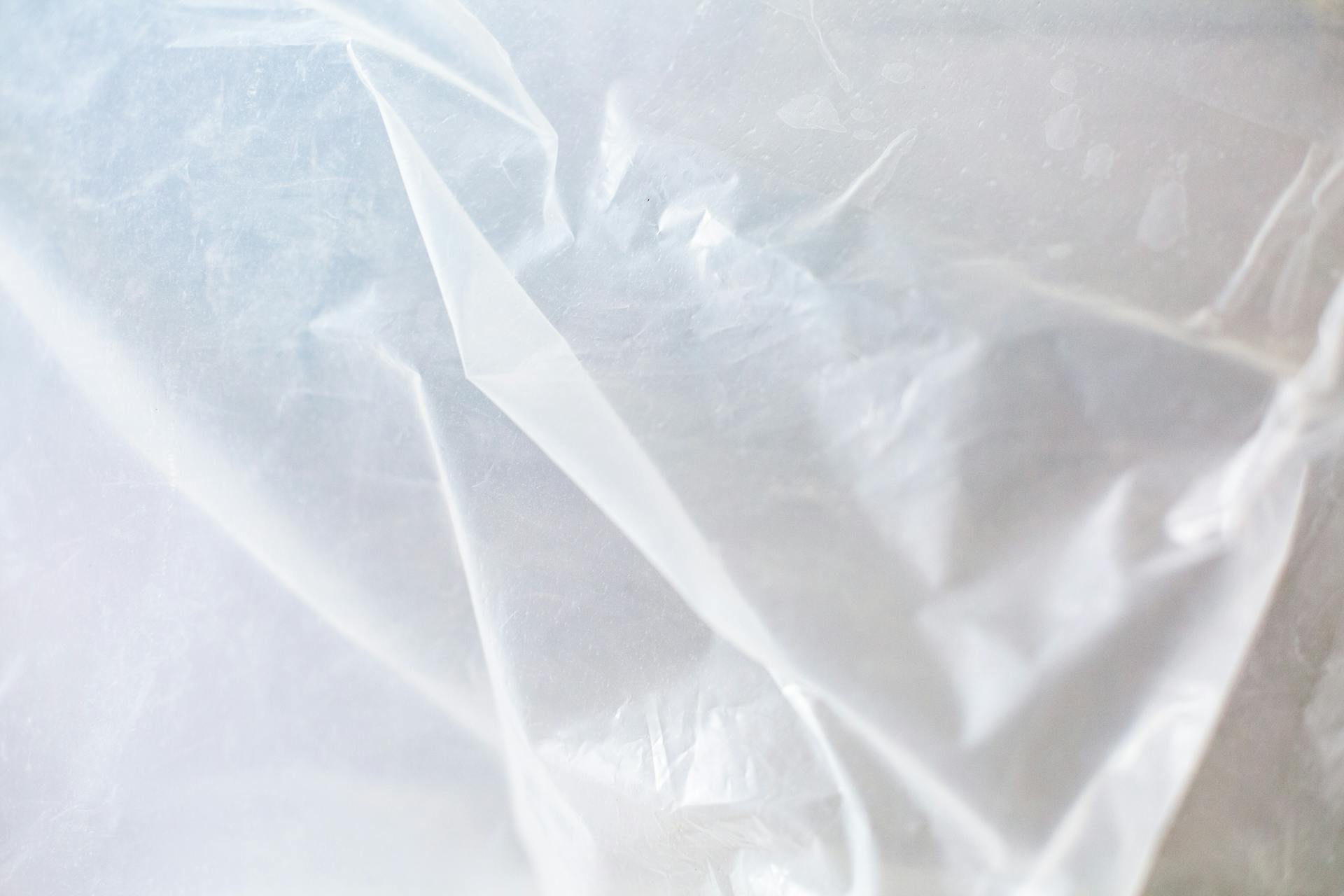 Close-up of transparent plastic sheeting used for covering surfaces during home renovation work.