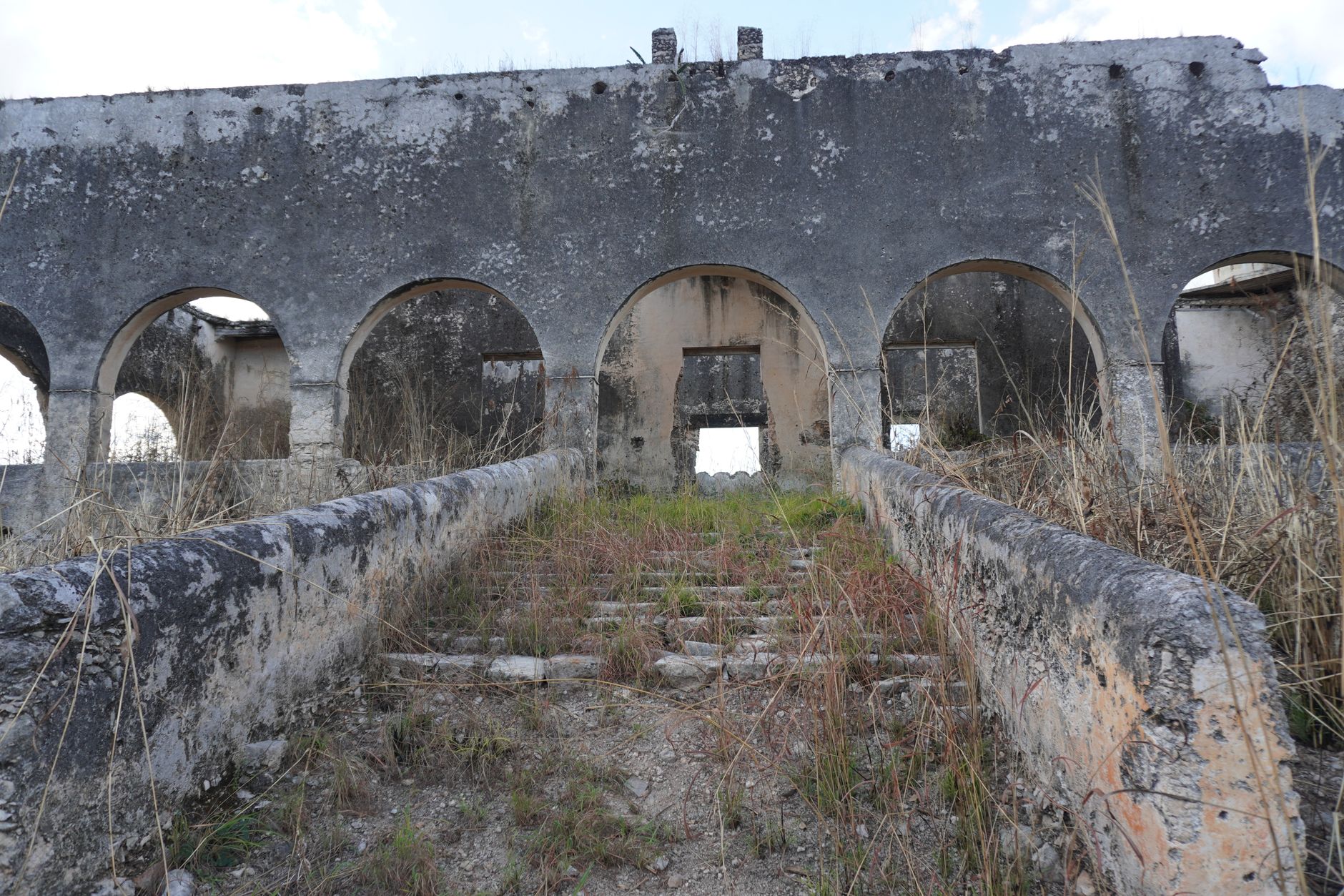 Explore the captivating ruins showcasing arched architecture in Yucatán, Mexico.