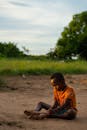 Child Playing in Sunlit Field in Madagascar