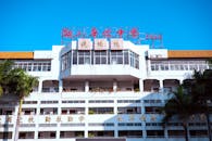 Front View of Urban School Building Under Blue Sky