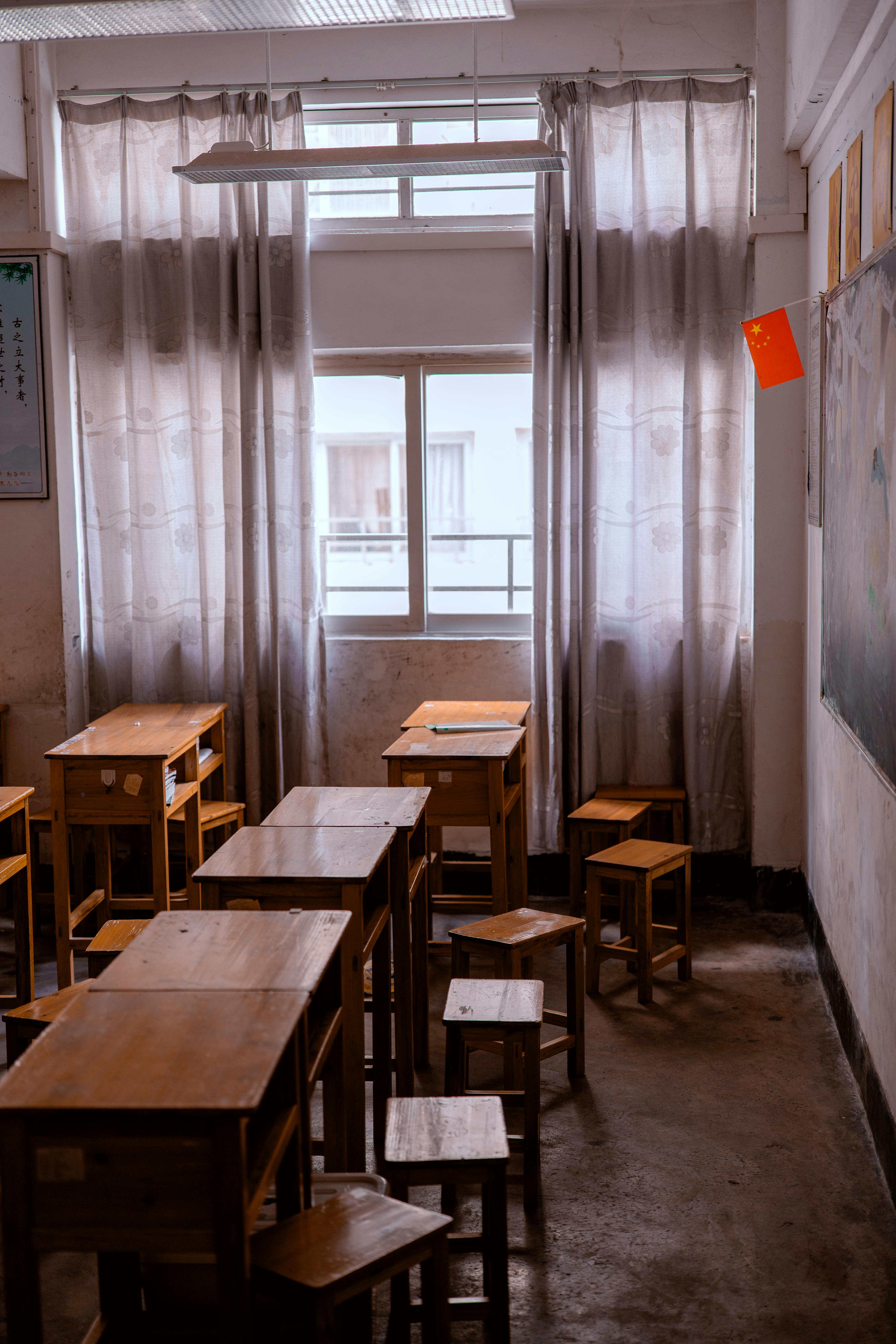 Empty Classroom with Wooden Desks and Chairs