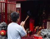 Young Boy Participating in Ancestral Worship Ceremony