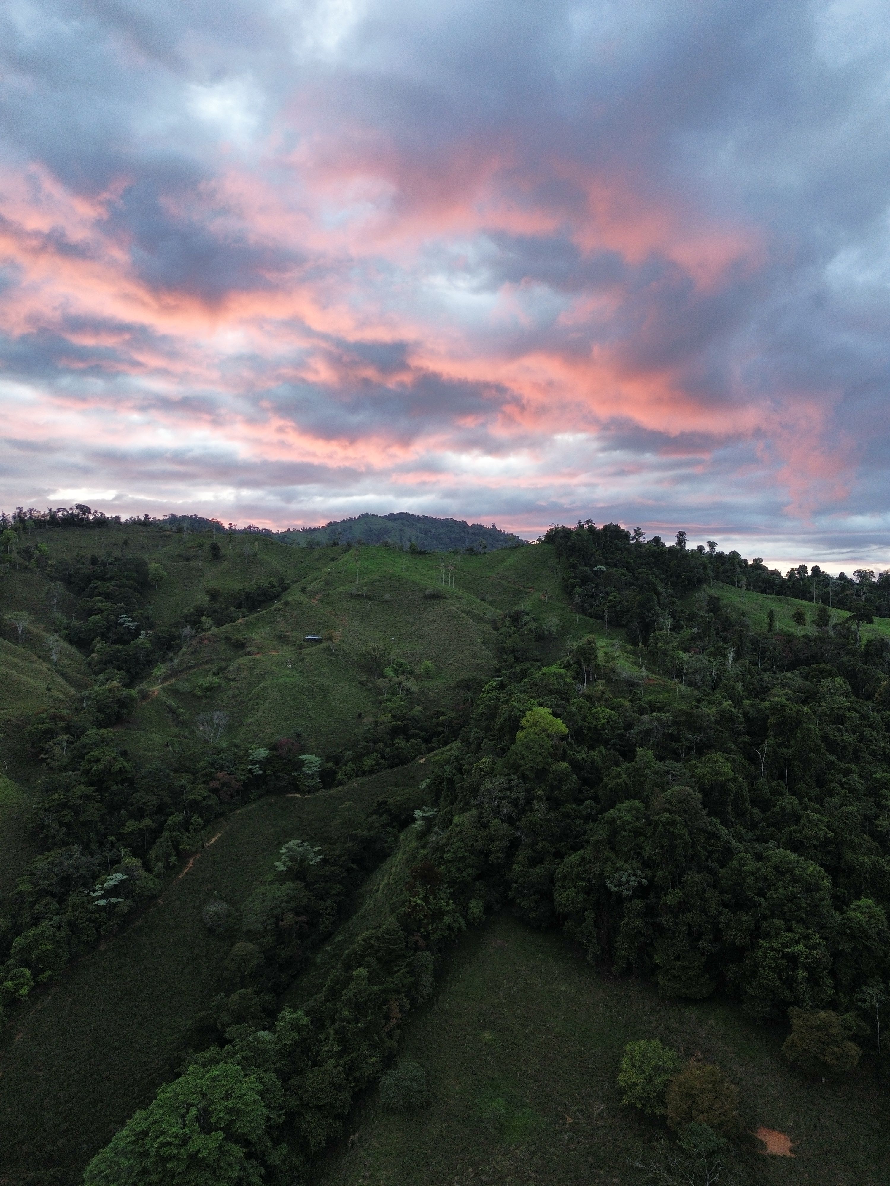 Scenic Sunset Over Lush Green Mountainscape · Free Stock Photo