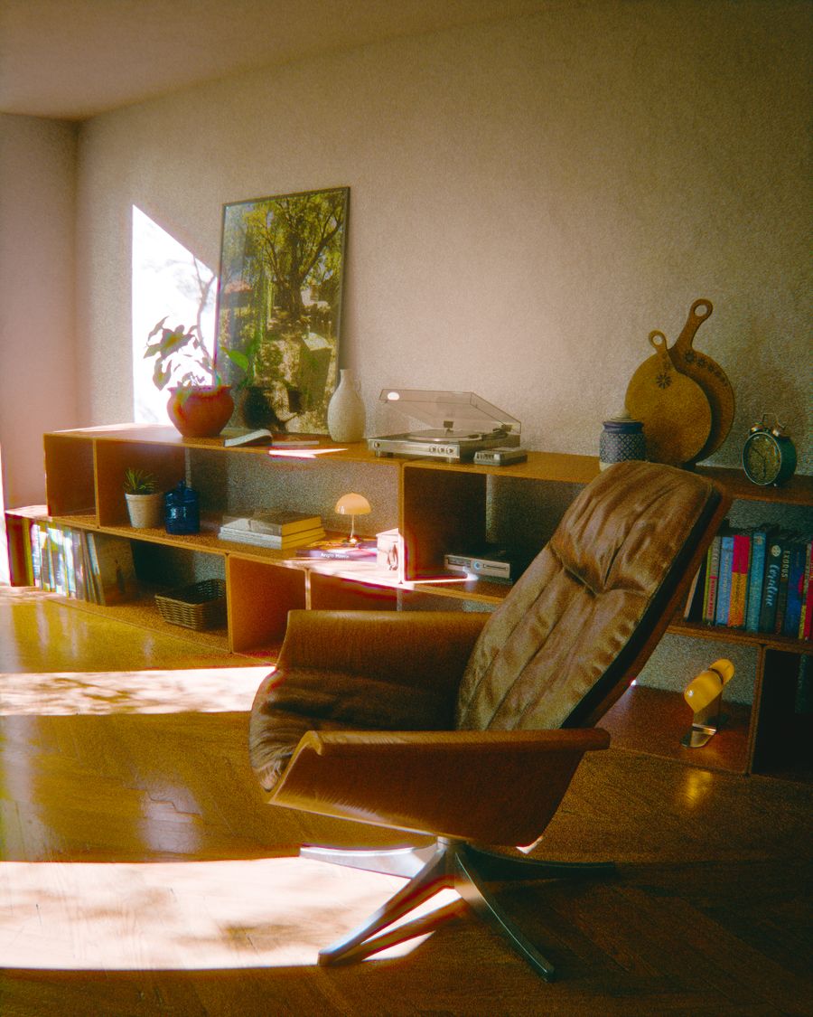 Mid-century room with a low shelf, record player and leather lounge chair in afternoon light — photo by Yusuf P on Pexels